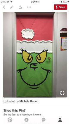 an image of a door decorated to look like the grinch from how the grinch stole