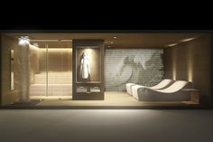 the interior of a modern bathroom is lit up at night