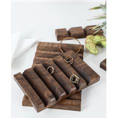 wooden jewelry trays with rings on them