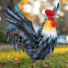 a colorful rooster is standing in the grass