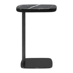 the side table is black and has a marble top, with a metal stand on one end