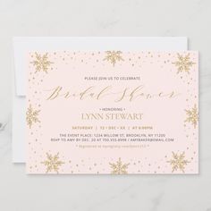 the pink and gold snowflake bridal shower card is shown on a marble surface