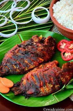 some meat and rice on a green plate