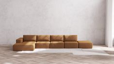 a brown couch sitting on top of a wooden floor next to a white rug in a living room