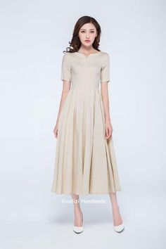 cream dress Classic V-neck Midi Dress For Summer, Classic Spring Midi Dress With Notched Neckline, Classic V-neck Maxi Dress For Summer, Classic Midi V-neck Summer Dress, Beige Linen Short Sleeve Dress For Spring, Short Sleeve Beige Linen Dress For Spring, Spring Beige Linen Dress With Short Sleeves, Elegant Short Sleeve Mid-length Dress For Summer, Summer Midi Dress With Box Pleat And Short Sleeves