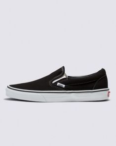 The Slip-On that’s been Setting Trends Since 1979Vans #98 was introduced in 1979, but this Classic Slip-On has come a long way. Black Slip-On sneakers don't come more stylish and spectacular than this. The low-profile canvas uppers, supportive padded collars, and rubber waffle outsoles take care of the comfort. All that remains is to slide in and hit the road. Vans beloved Slip-On sneakers provide convenience and comfort in equal measure. A Classic Slip-On sneaker for the modern world? Look no further. Iconic Slip-On shoe Low profile canvas uppers Supportive padded collars Elastic side accents Signature rubber waffle outsoles | Vans Classic Slip-On Shoes (Black) - 11.0 Men/12.5 Women Vans Slip On Pro, Black Slip On Sneakers, Vans Store, Timeless Shoes, All That Remains, Vans Slip On, Black 13, Wide Shoes, Red Heels