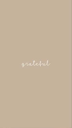 the word grateful written in white on a beige background