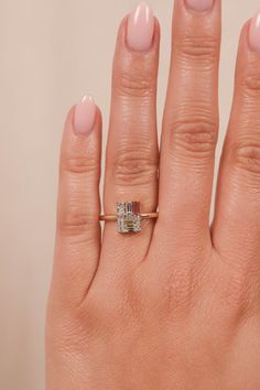 a woman's hand with a ring on it