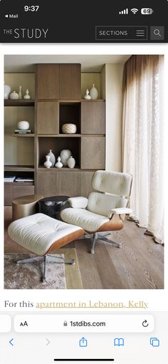 an image of a living room with furniture on the floor and shelves in the background