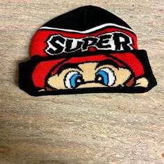 a red and black hat with the word super on it