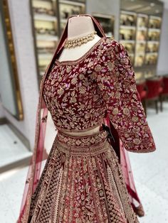 Unleash your inner royalty with our Maroon Multi Color Bridal Lehenga BL-145! Made from luxurious velvet and adorned with intricate resham work and gold zardozi, this lehenga is sure to make a statement. Perfect for any bride looking to make a stunning entrance on her special day. Fabric: Velvet! WASH CARE INSTRUCTIONS - Please Dry clean only when it is applicable! Ready to Ship! Indian Bridal Lengha, Maroon Lehenga, Wedding Lenghas, Latest Bridal Lehenga Designs, Heavy Lehenga, Velvet Lehenga, Bridal Lengha, Bridal Lehenga Designs, Latest Bridal Lehenga