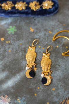 Owl Earrings, Witch Earrings, Crescent Moon, Gold Plated Owls with pearl beads and Moon in recycled leather. Made in France Mystical Gold Moon Charm Earrings, Gold Hypoallergenic Moon-shaped Earrings, Symbolic Gold Moon-shaped Earrings, Handmade Moon-shaped Spiritual Earrings, Mystical Moon-shaped Brass Earrings, Witch Earrings, Owl Earrings, Recycled Leather, Crescent Moon