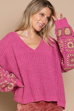 Final Sale - Get it before it's gone! The perfect fall sweater, the Marsha Pink Crochet Sleeve Sweater is a must-have! Made with pink knit, this top is sure to be a conversation starter. Featuring a V-neckline, long bell sleeves sheer crochet grandma squares. Style it with your fav ripped jeans for an effortless look! DETAILS & CARE Polyester. Machine wash cold. Imported. Fall Crochet V-neck Top With Crochet Trim, Pink V-neck Open Knit Sweater, Fall V-neck Crochet Top, Spring Open Knit Long Sleeve V-neck Sweater, Spring Long Sleeve Open Knit V-neck Sweater, Pink Crochet Tops For Fall, Casual Long Sleeve Crochet Top For Fall, Bohemian Crochet Long Sleeve Top With Textured Knit, Trendy Fall Crochet Sweater