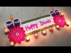 happy diwali greeting card with candles and flowers