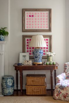 a living room filled with furniture and paintings on the wall