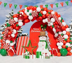 an arch decorated with christmas decorations and balloons