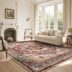 a living room filled with furniture and a large rug on top of a hard wood floor