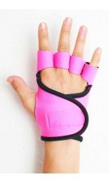 a hand with pink wrist pads and black band around it's thumb, on top of a white wall