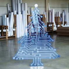 a christmas tree made out of printed circuit boards in a room filled with other items