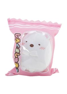 a white stuffed animal in a pink package