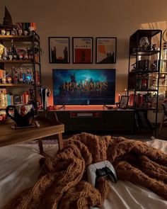 a bedroom with a harry potter poster on the wall