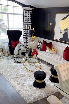 a living room with black walls and white carpeted flooring is decorated in modern style