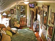 an attic bedroom with lots of furniture and pictures on the walls