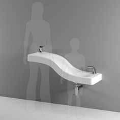 a white sink sitting on top of a counter next to a man standing in front of it