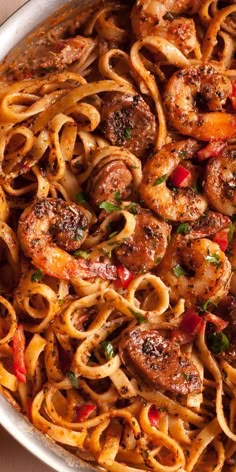 pasta with shrimp and peppers in a pan