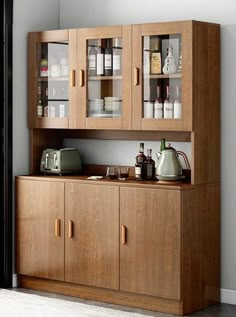 a wooden cabinet filled with lots of bottles