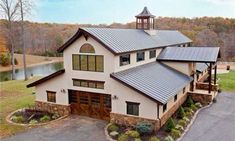 a large white house with a metal roof