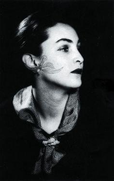 black and white photograph of a woman with her nose painted to look like a butterfly