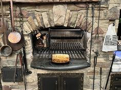 an outdoor pizza oven with various cooking utensils