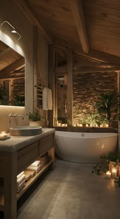 a bathroom with a large tub, sink and candles on the counter next to it