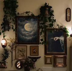 there are many paintings on the wall with plants growing up and down them, along with other decorations