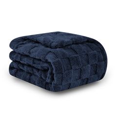 the blue blanket is folded on top of each other