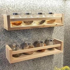 two wooden shelves with spice jars on them