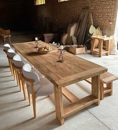 a large wooden table with chairs around it