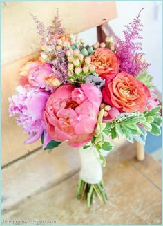 a vase filled with pink flowers on top of a table