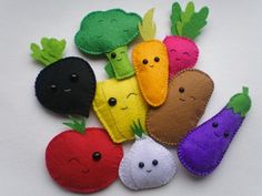 a group of felt veggies sitting on top of each other