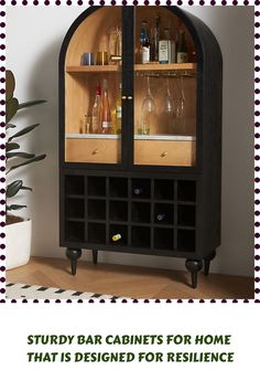 a black cabinet with wine glasses and bottles in it that says study bar cabinets for home that is designed for resilince