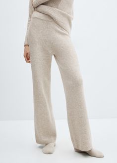 Knitted pyjama pants - Woman | MANGO USA Casual Cashmere Bottoms With Ribbed Waistband, Elegant Knit Bottoms For Winter, Elegant Beige Knit Bottoms, Elegant Knit Pants For Loungewear, Chic Cashmere Winter Bottoms, Chic Winter Cashmere Bottoms, Elegant Ribbed Pants For Fall, Chic Knit Trousers, Chic Wide-leg Knit Bottoms