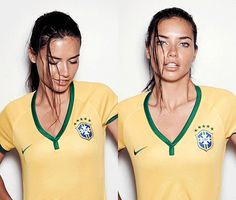 two beautiful women in yellow soccer uniforms posing for a photo with their hands on their hips