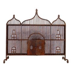 an old iron gate with two doors and a fan on the front, isolated against a white background