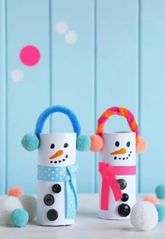 two snowmen made out of toilet paper rolls