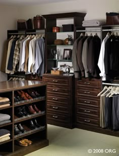 an organized closet with clothes and shoes