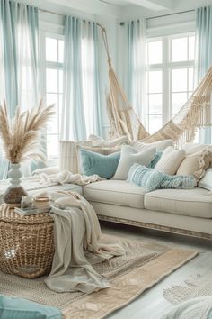 a living room filled with lots of furniture and pillows on top of a rug next to a window