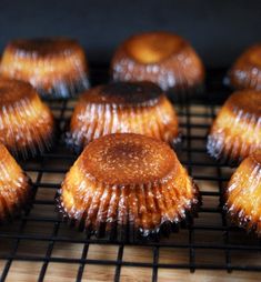 there are many cupcakes on the cooling rack