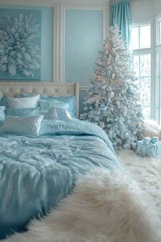 a bedroom decorated in blue and white with a christmas tree next to the bed,