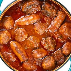 meatballs and gravy in a blue pot